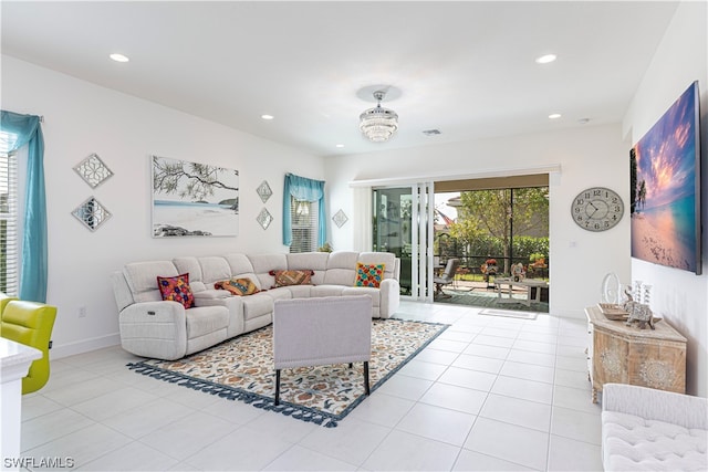 tiled living room featuring ceiling fan