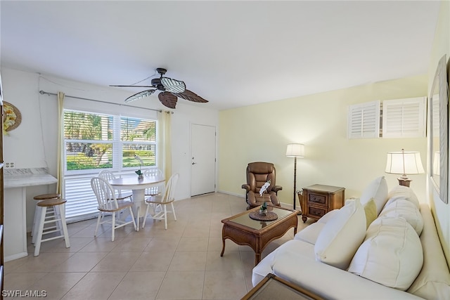 tiled living room featuring ceiling fan