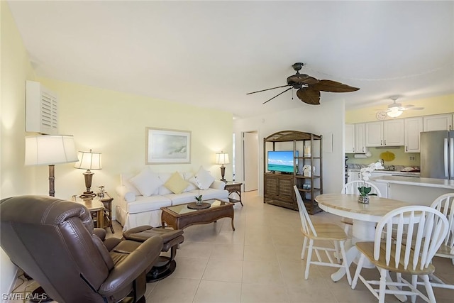 tiled living room featuring ceiling fan