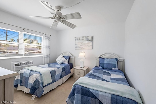 tiled bedroom with a wall mounted AC and ceiling fan