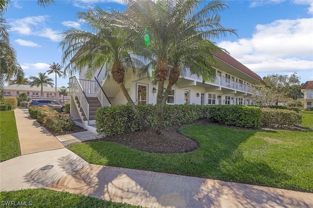 view of property exterior featuring a yard