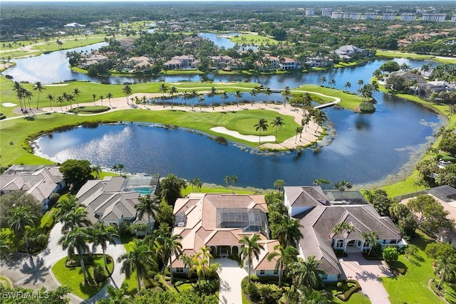 birds eye view of property featuring a water view and a residential view