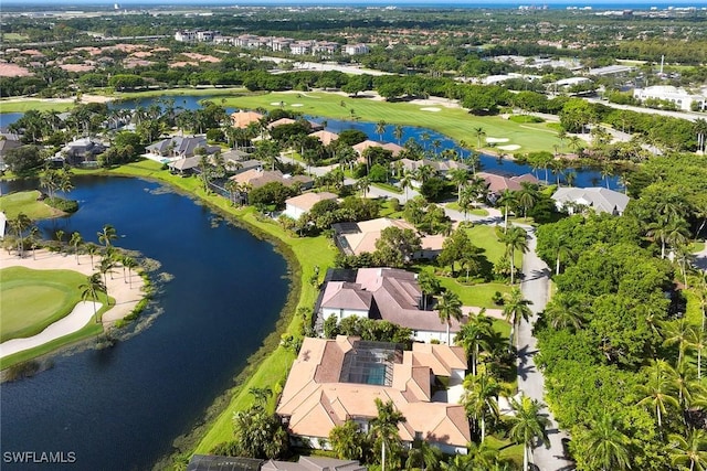 bird's eye view with a residential view, view of golf course, and a water view