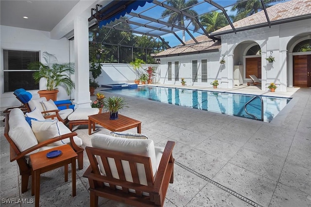 view of pool featuring a patio, a lanai, french doors, a pool with connected hot tub, and an outdoor living space