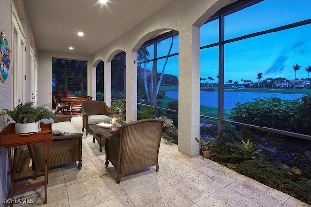 sunroom with a water view