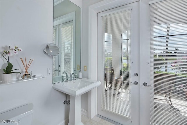 doorway with french doors and a sink