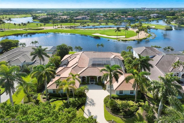 bird's eye view with a water view, view of golf course, and a residential view