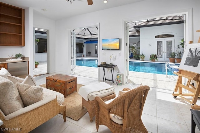 living room featuring light tile patterned floors, ceiling fan, french doors, and recessed lighting