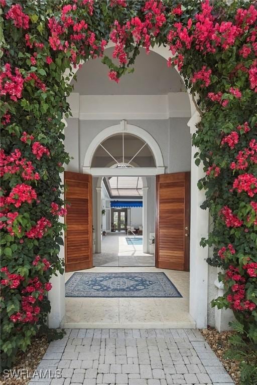 entrance to property featuring stucco siding
