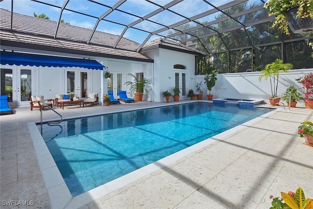 view of swimming pool featuring a patio, an outdoor living space, a pool with connected hot tub, and french doors