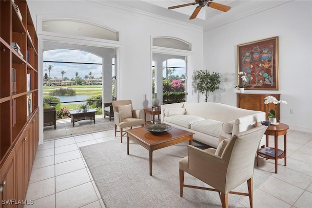 living room featuring crown molding, a ceiling fan, light tile patterned flooring, and a water view