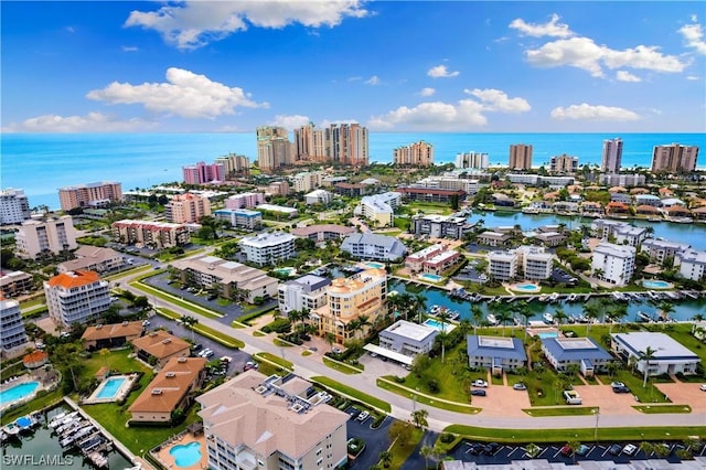 bird's eye view featuring a view of city and a water view