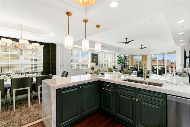 kitchen featuring dark wood-type flooring, sink, stainless steel dishwasher, ceiling fan, and decorative light fixtures