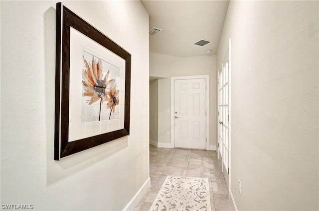 hallway with light tile flooring