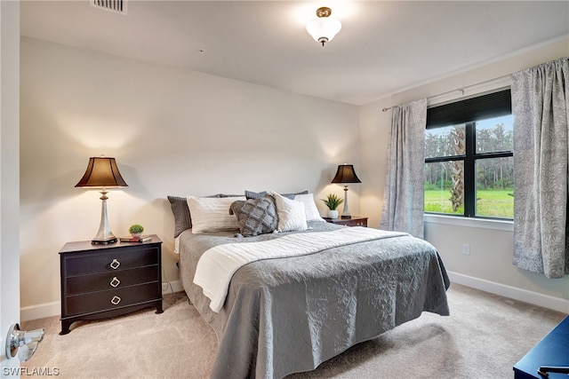 bedroom with light carpet