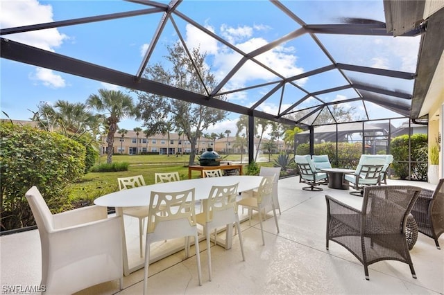 view of patio with glass enclosure