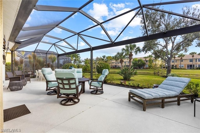 view of patio featuring glass enclosure