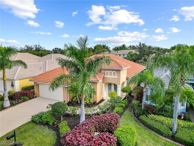 mediterranean / spanish home with a garage