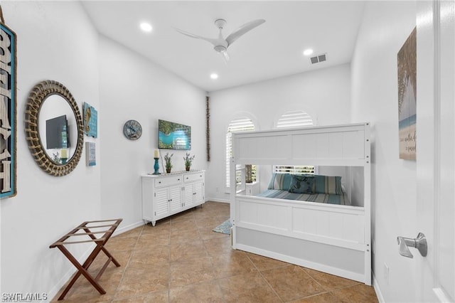 interior space with ceiling fan and light tile patterned flooring