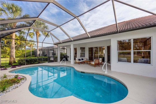 view of pool featuring glass enclosure, an outdoor living space, and a patio