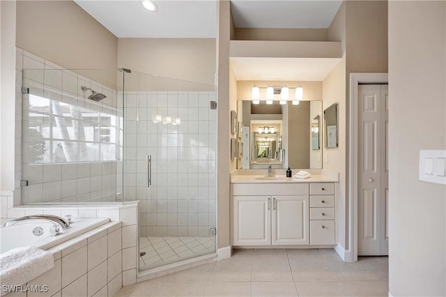 bathroom featuring tile patterned floors, vanity, and separate shower and tub