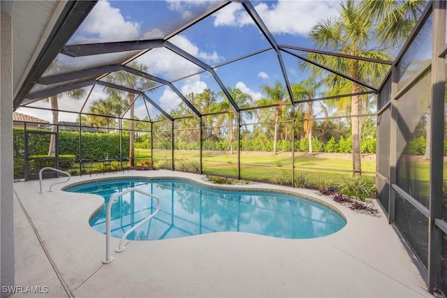 view of swimming pool with a lanai and a patio