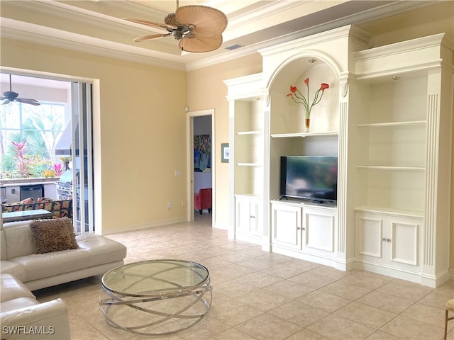 tiled living room featuring built in shelves, ceiling fan, and ornamental molding