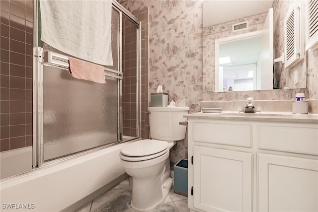 bathroom featuring enclosed tub / shower combo, toilet, vanity, visible vents, and wallpapered walls