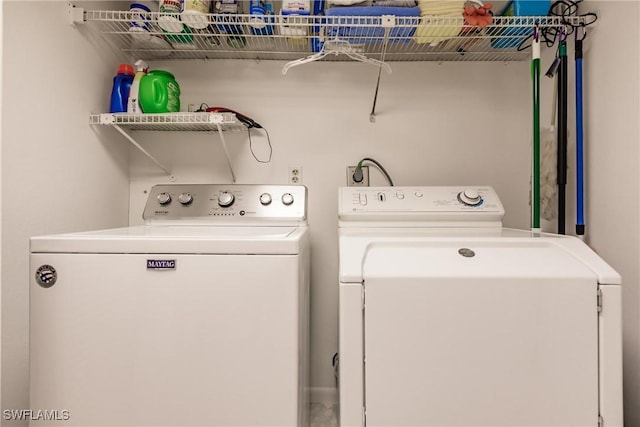 washroom featuring laundry area and washer and dryer