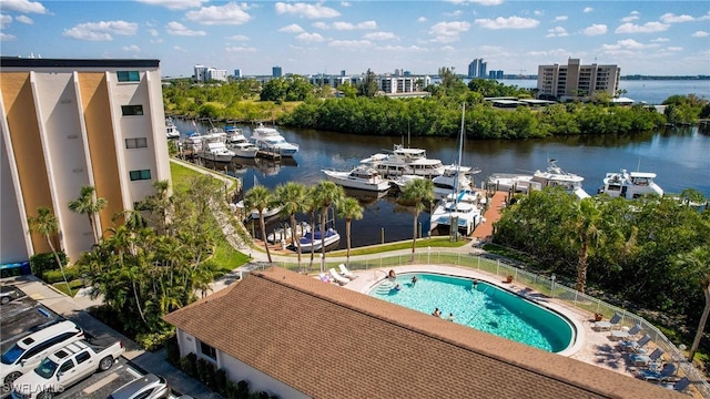 pool with a view of city, a water view, and a patio