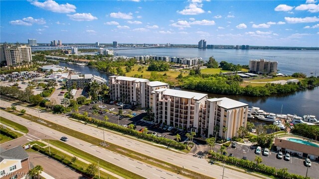 bird's eye view featuring a water view and a city view