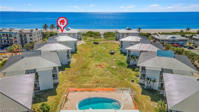 drone / aerial view with a view of the beach and a water view