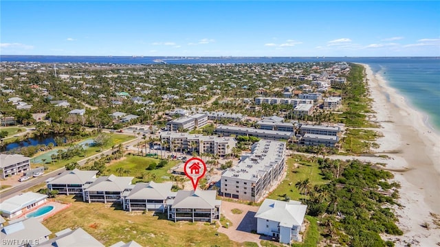 drone / aerial view with a view of the beach and a water view