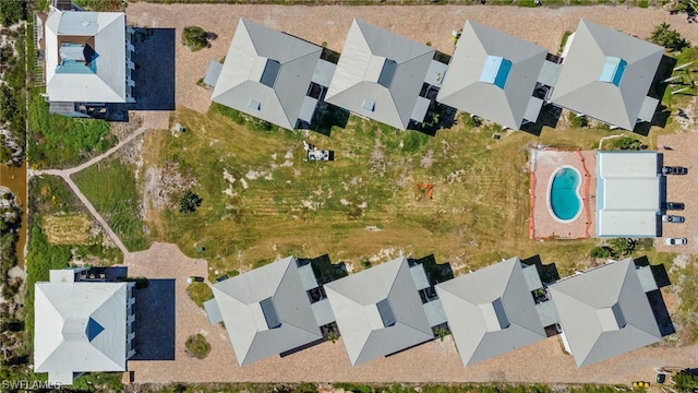 birds eye view of property with a residential view