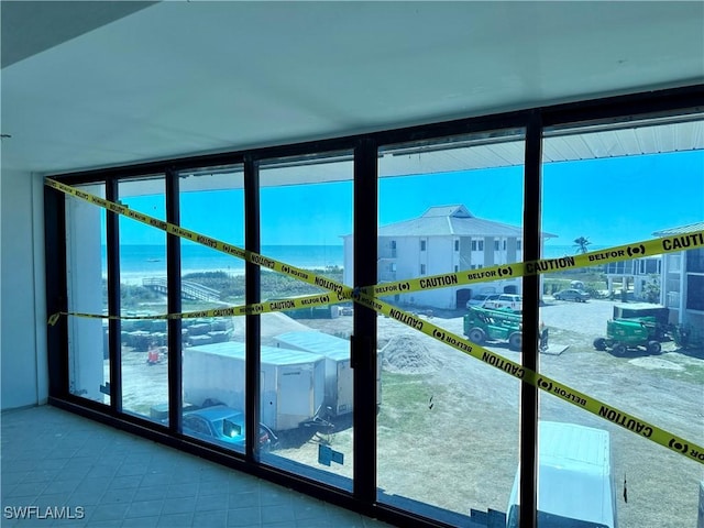 entryway with floor to ceiling windows
