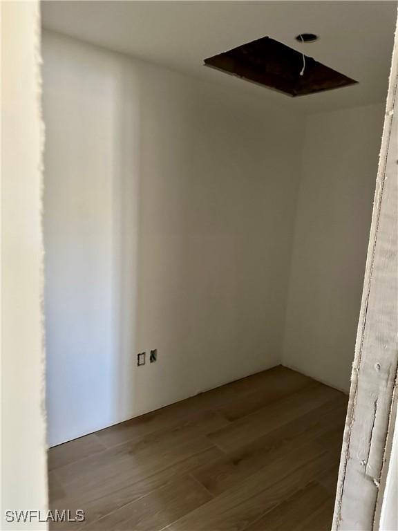 empty room with wood finished floors