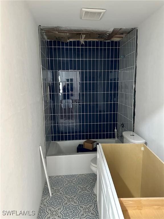 full bathroom featuring visible vents, toilet,  shower combination, tile patterned flooring, and vanity