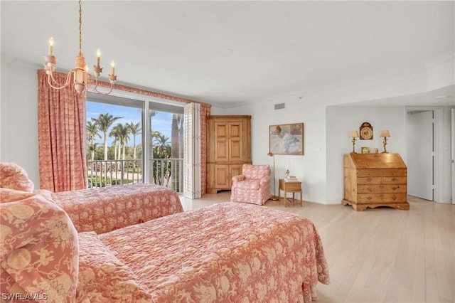 bedroom with access to exterior, ornamental molding, light hardwood / wood-style floors, and a notable chandelier