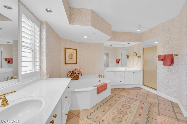 bathroom with vanity, tile patterned flooring, a healthy amount of sunlight, and separate shower and tub