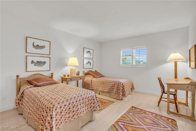 bedroom with light wood-type flooring