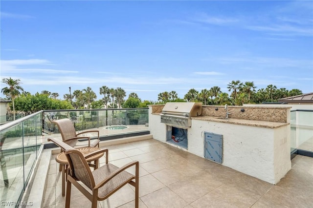 view of patio / terrace featuring sink, exterior kitchen, and grilling area