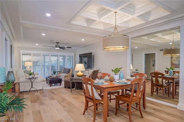 dining room featuring beamed ceiling, coffered ceiling, ornamental molding, and light wood finished floors