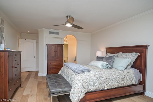 bedroom featuring ornamental molding, light hardwood / wood-style flooring, and ceiling fan