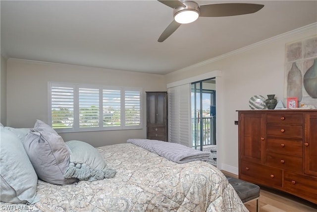 bedroom with multiple windows, light wood-type flooring, crown molding, and access to outside