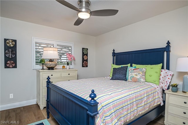 bedroom with hardwood / wood-style floors and ceiling fan