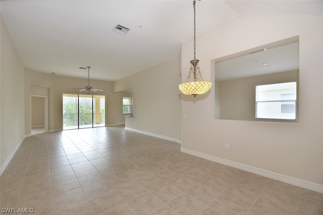 empty room with light tile floors and ceiling fan