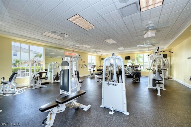 exercise room with ceiling fan