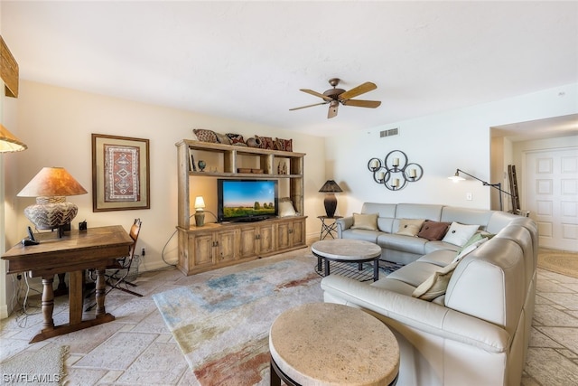 living room with light tile floors and ceiling fan