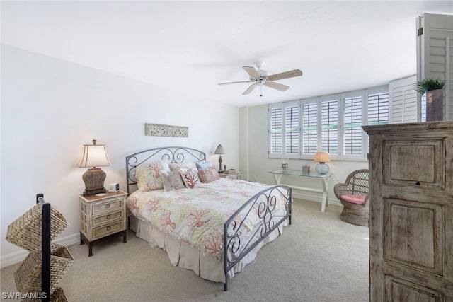 bedroom featuring light carpet and ceiling fan