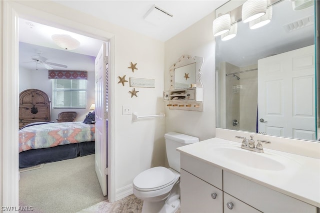 bathroom with tile flooring, oversized vanity, ceiling fan, and toilet